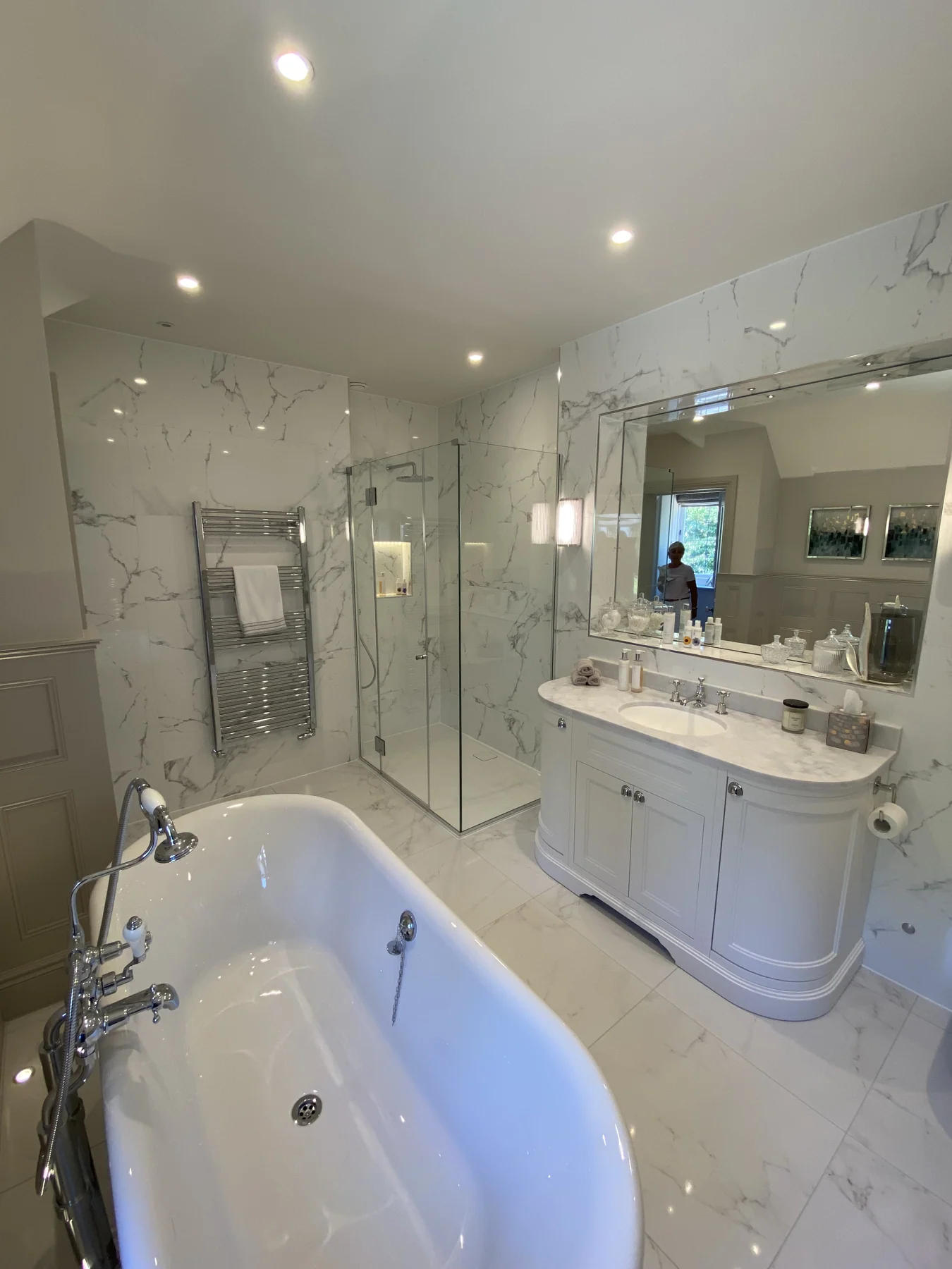 A bathroom refit by Tom Timlin with marble-effect wall and floor tiles